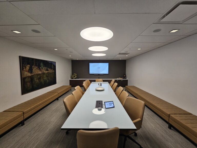 Modern boardroom AV system with ceiling-mounted projector by Alanson Media